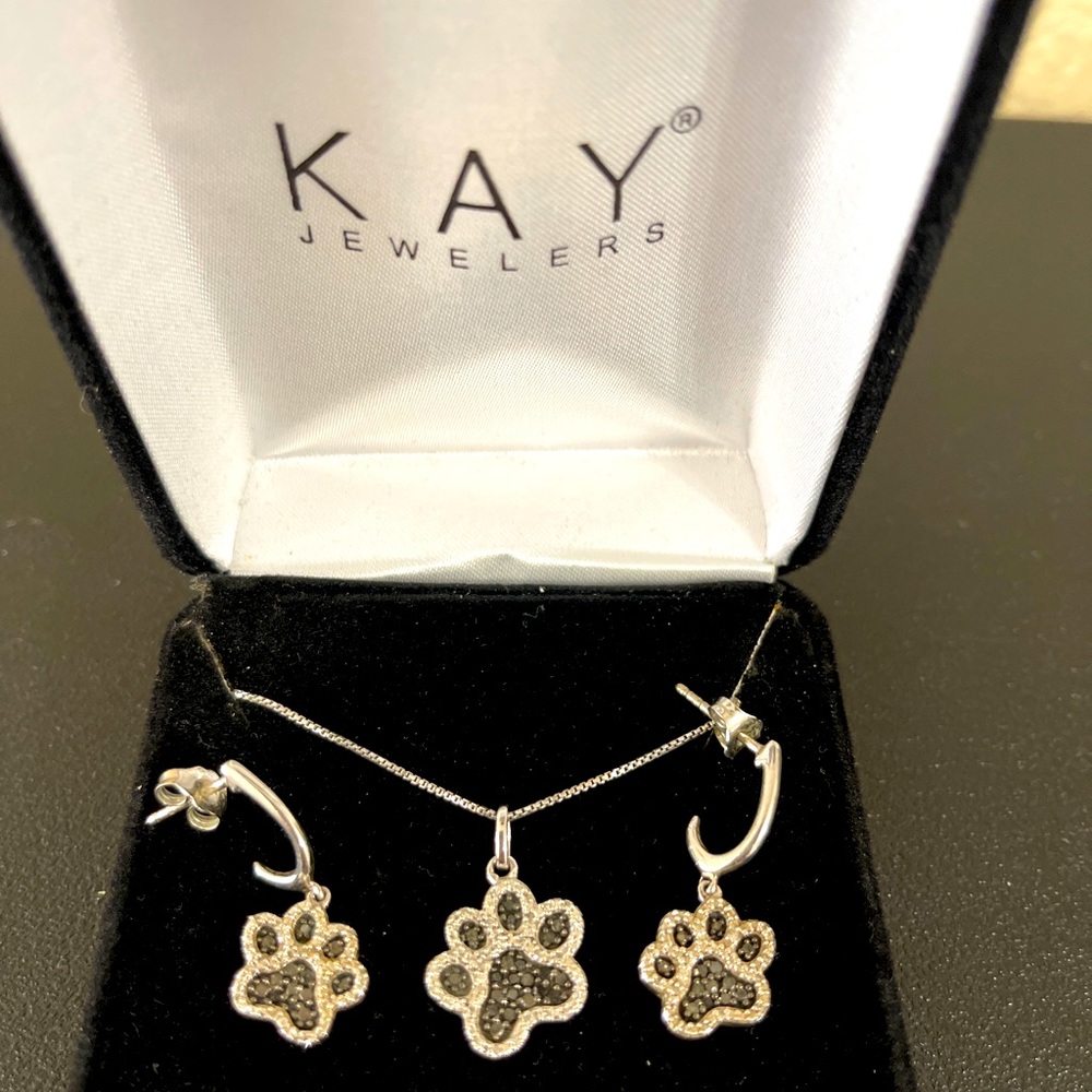 Kay jewelers paw print black and white earring and necklace set.